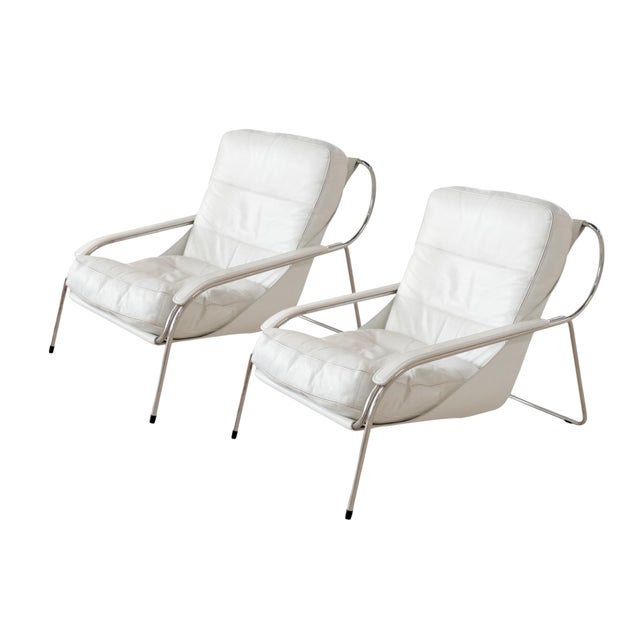 A pair of Maggiolina Lounge Chairs, one with an ottoman, designed by Marco Zanuso circa 1947. The set feature an 18/8...