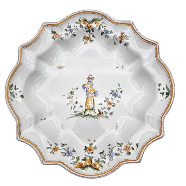 This hand-painted faience plates were produced by A. Faxil in Riez, a Provençal atelier working within the Moustiers...