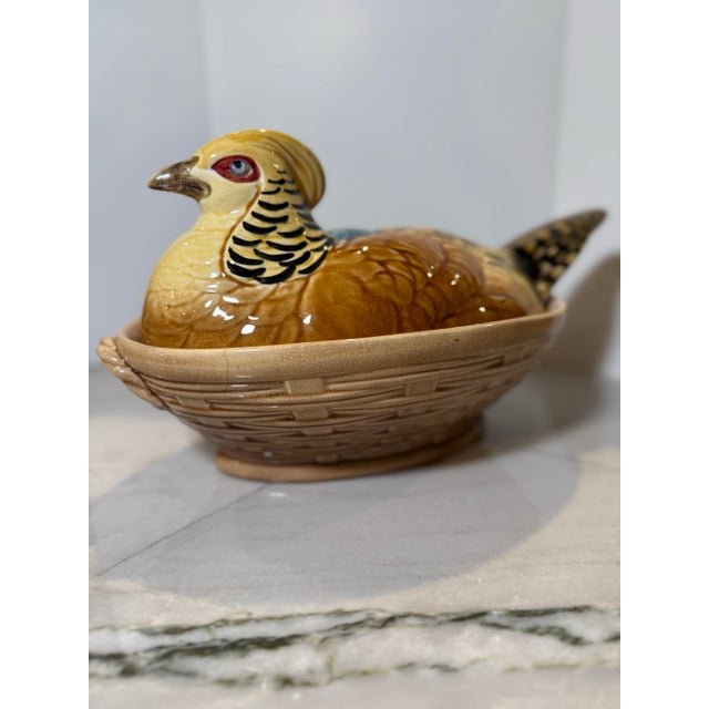 A striking mid-century French Majolica nesting pheasant tureen by the historic earthenware manufacturer Sarreguemines....