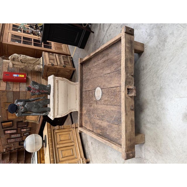 This large coffee table was crafted from an old cider press, giving it a rugged, authentic look. Lovely traces of its past...