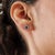Princess Diana-Inspired Oval Blue Sapphire & Diamond Halo Cluster Stud Earrings - A Pair features 0.6 carats of oval blue...