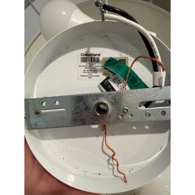 Discontinued Crate & Barrel white linen drum flush-mount ceiling light dating to 2019. A clean, architectural ceiling...