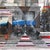 This artwork captures a dynamic urban scene in Denver, blending photographic realism with abstract elements. The striking...