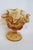 This gorgeous Compote Dish is made out of glass. This lovely piece has an exquisite honey amber color to the glass, a...