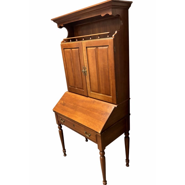 Beautiful vintage Brandt secretary desk with hutch, featuring a classic cherry finish and timeless design. This piece...
