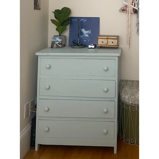 A charming four-drawer chest finished in a soft teal with matching painted ball knobs. Solid wood construction throughout....
