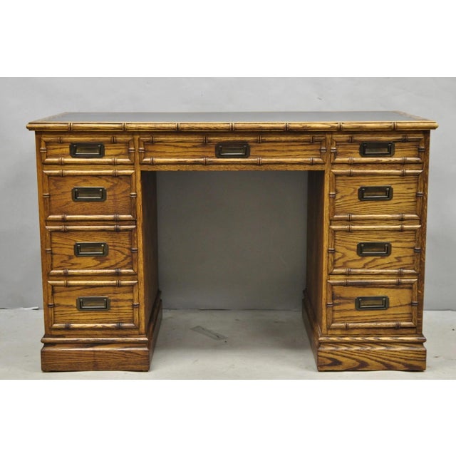 Vintage Hollywood Regency Faux Bamboo Campaign Style Kneehole Desk by Sligh. Item features 7 dovetailed drawers, inset...