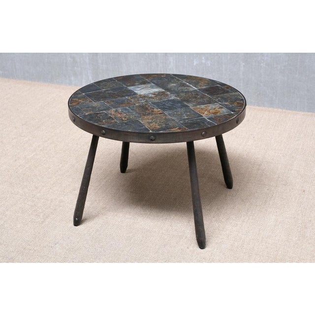 This striking round side table was produced in France in the 1970s. Executed in a Brutalist style, this piece combines raw...
