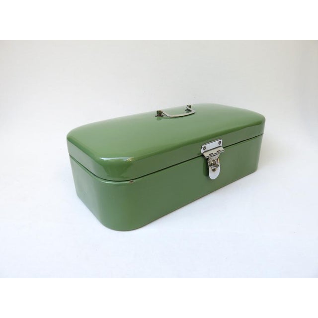 A rare lunch box from the Art Nouveau period in a well-kept condition. The box is enamelled green on the outside and white...