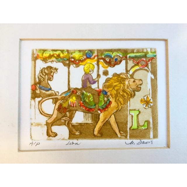 A beautiful, cheerful and colorful artists proof of a letter L and a boy riding a merry-go-round lion by Marilyn Davis....