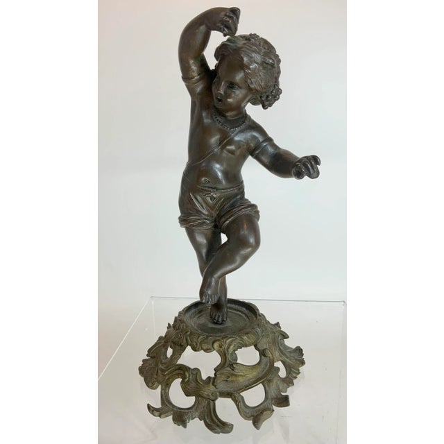 Great antique sculpture or a Da sing little girl. Castanets in both hands, rotate gilt base. Some kind of makers mark...