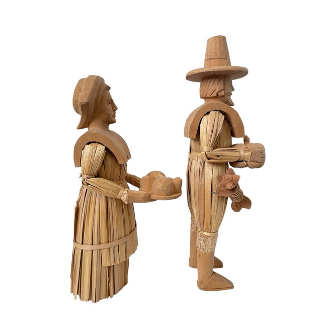 This set of 2 carved corn husk figures features 13 and 16-inch tall Pilgrim figures, perfect for adding a historical and...