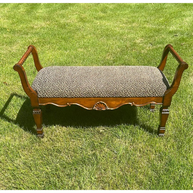 This Neoclassical-styled window bench is such a handsome piece! From its animal-print, upholstered seat, to the seashell...