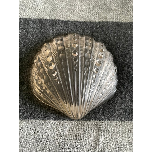 New in Box - Lalique Frosted Crystal Scallop Shell Dish Featuring fine textured radial lines and bead detailing in a...