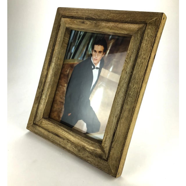 Heavy wood hand carved in India. We can’t be sure of the type of wood, but it is solid. Only one corner at the top has an...