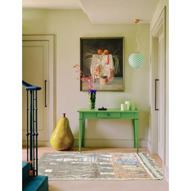 Boujad Rug | Handwoven Berber Wool Rug with Two-Tone Field and Abstract Figures This atmospheric Boujad rug features a...