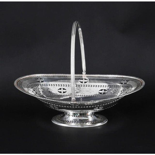This is a stunning antique English Victorian Neo-classical silver-plated fruit or bread basket, circa 1860 in date. The...