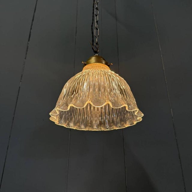 Beautiful medium-sized pressed glass holophane pendant lamp by the german brand asteroid drp, 1920s. Fitted with a brass...