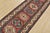A tribal Caucasian Kazak runner hand-knotted with fine wool on a cotton foundation. This rug features a row of geometric...