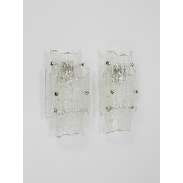A stunning pair of modernist "melting glass“ wall lights, designed and crafted by j.t. Kalmar in vienna, austria. These...