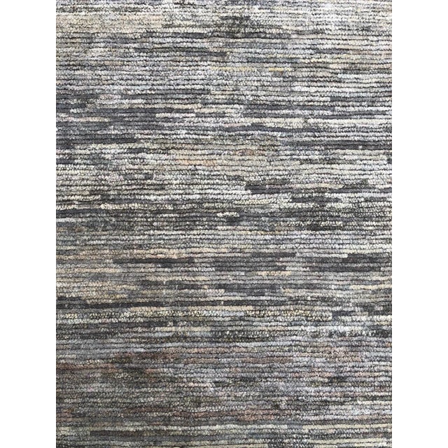 From Rug & Kilim’s Texture of Color Collection, this 6’x9’ modern rug is handmade with a proprietary blend of quality silk...
