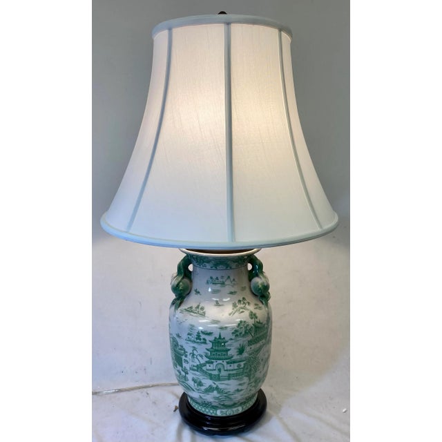 Handled Porcelain Jar Vase Table Lamp on Wooden Base Decorated in a Soothing Green Asian Landscape Scene With White Lampshade For Sale - Image 13 of 13