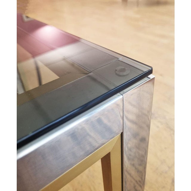 Square coffee table/end table with chrome metal base lined with brass veneer, topped with a smoked glass top Design Renato...