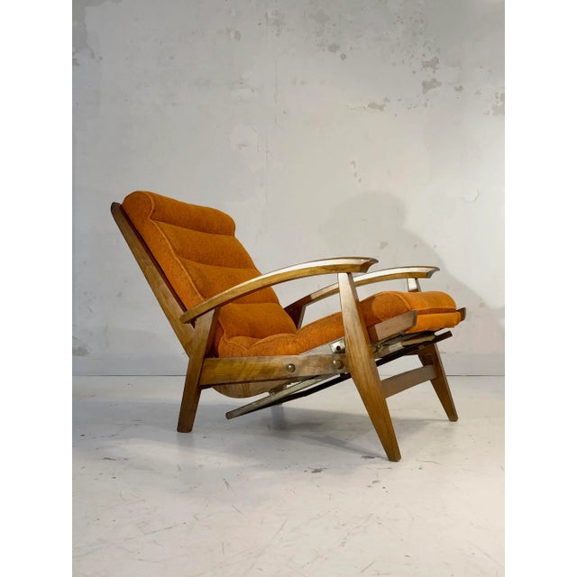 A very comfortable chair system, modernist, dynamic solid oak frame and seat of origin in orange rich fabrics, guy besnard...