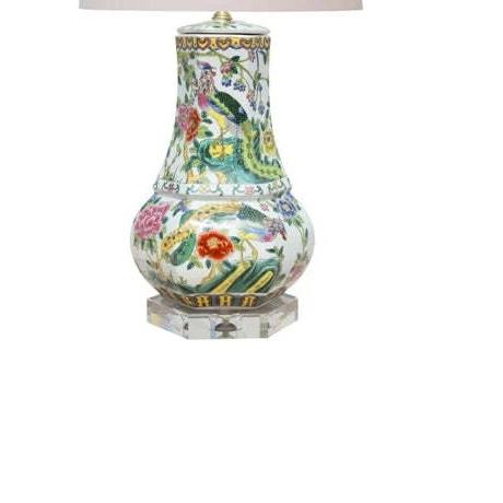 Colorful phoenix birds and flowering branches decorate this six-sided porcelain vase lamp, bringing pattern and warmth to...