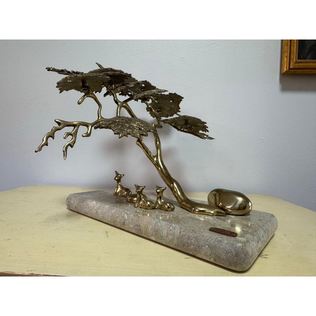 A freestanding brass bonsai tree sculpture by artist Bijan, hand-cast and torch-cut in the Brutalist style popular in the...