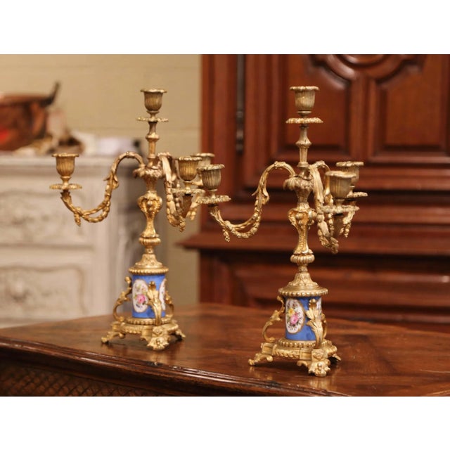 Elevate a mantel or dining table with this refined pair of French Louis XVI candelabras, crafted circa 1870 with...