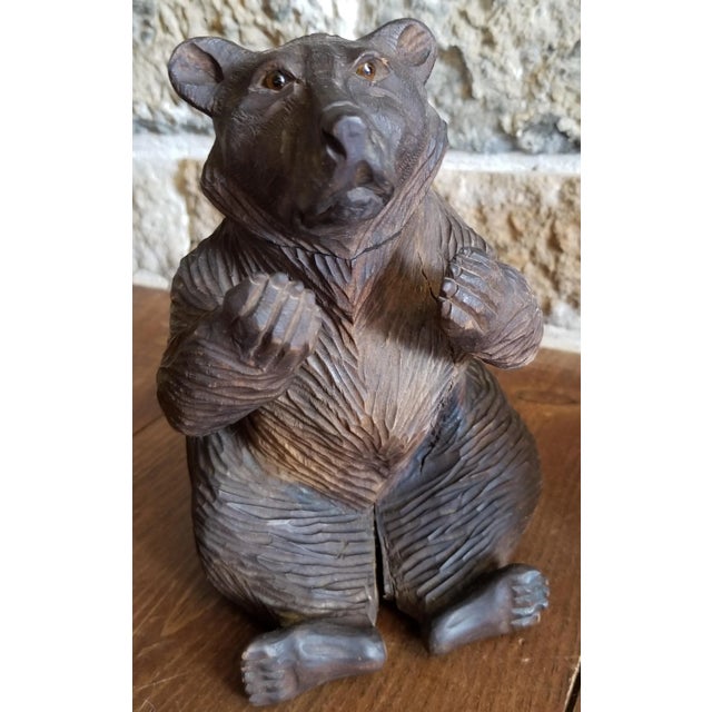Antique bear form inkwell with glass eyes.