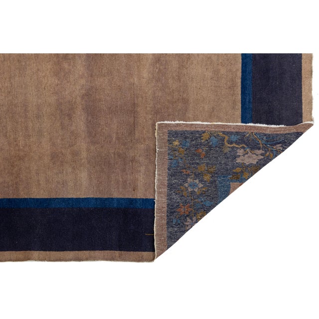 This Antique Chinese Art Deco rug from the 1920s a stunning example of early 20th-century textile design. It features a...