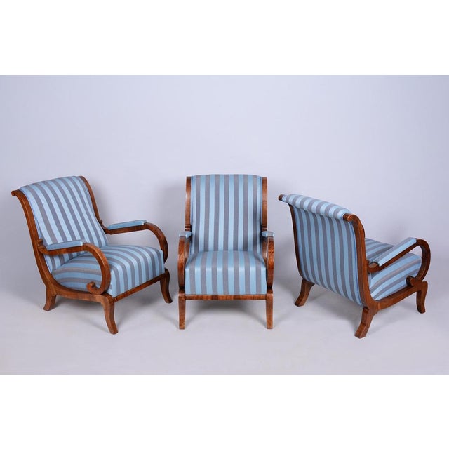 This set of three armchairs is a truly magnificent and refined showcase of high-end bourgeois furniture from the early...