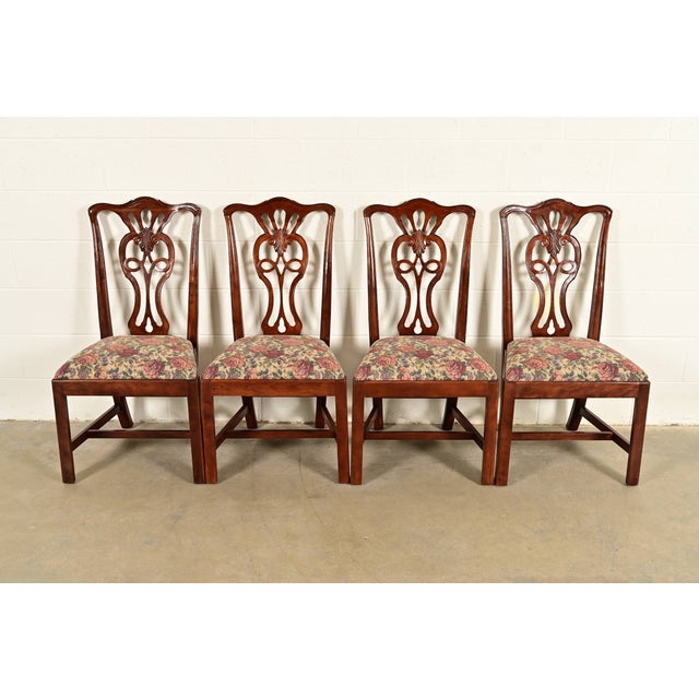 An outstanding set of four Chippendale or Georgian style dining chairs By Henredon USA, Circa 1980s Carved mahogany...