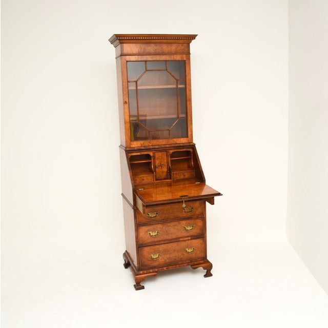 A stunning antique Georgian style burr walnut bureau bookcase of slim proportions. This was made in England, it dates from...