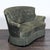 This vintage classic loveseat features a plush green velvet upholstery with a button-tufted backrest and rolled arms for...