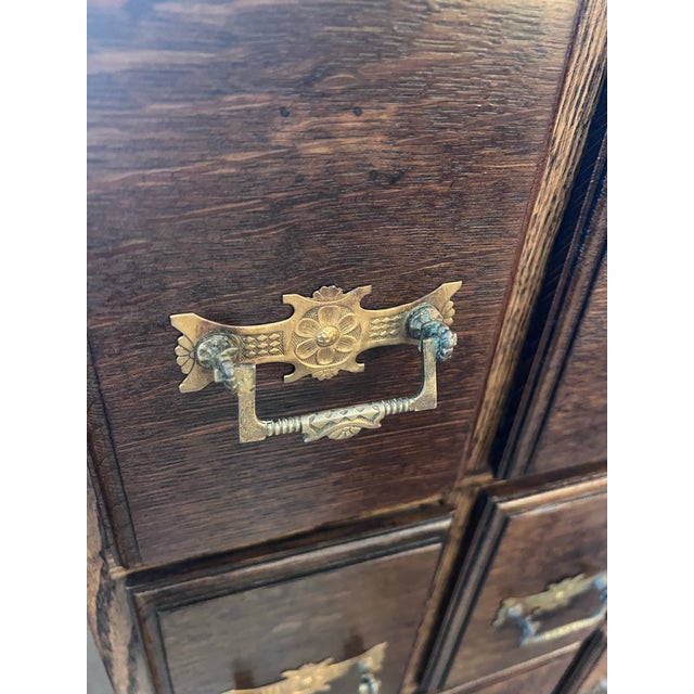This is a completely professionally refinished 12 drawer cabinet with amazing drawer pulls. In excellent like new...