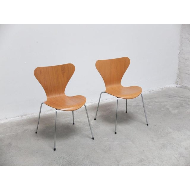 Pair of ‘Series 7’ dining chairs designed by Arne Jacobsen in 1955. These examples are made of beautiful warm oak wood. In...