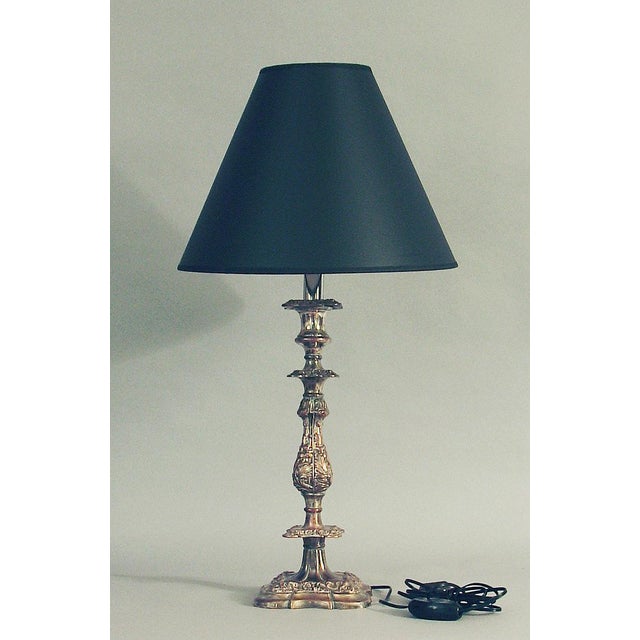 Offering a pair of handsome silver-plated candlesticks-as-lamps, each having a lovely old patina and in excellent antique...