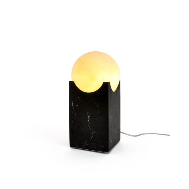 Eclipse lamp in marble. It gives a distinct and elegant touch to your house. Each piece is in a way unique (every marble...