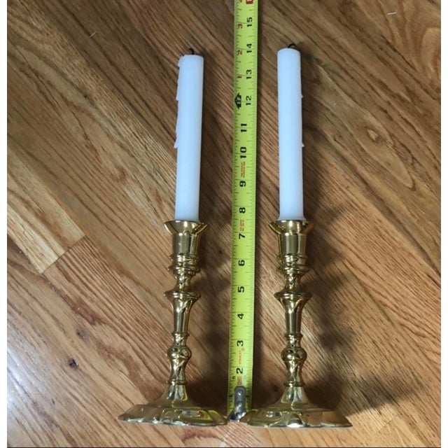 Pair of Baldwin brass 7” fancy shiny brass candlesticks with felted bottom and brand stamping