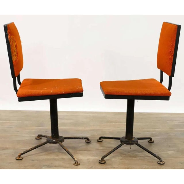 I'm selling a ca. 1950's Mid Century Modern pair of black steel chairs. The have the original paper label for Syd leach...