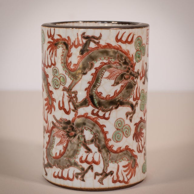 Fine chineese crackleware brush pot with dragon design. Signed below top rim. Artist name: unknown at present approx date:...