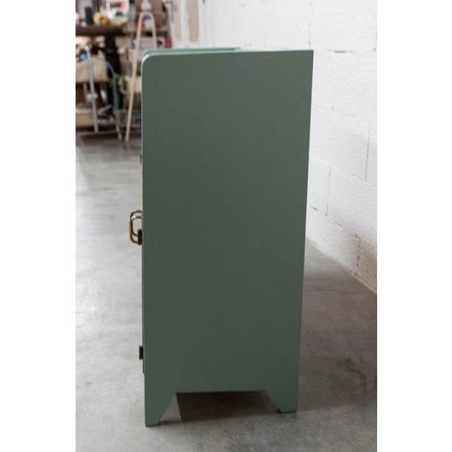 Unique 1960s low display cabinet with a recently repainted, nobile green (manufacturer's name) finish and glossy gold...