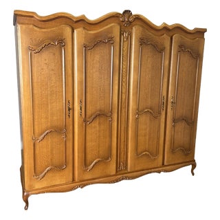 Vintage French Louis XVI Style Carved 4-Door Armoire For Sale