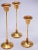 his set is composed of three candlesticks, in brass. it has been made in sweden circa 1960. The color is gold.
