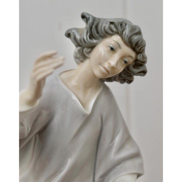 Vintage (1976) Retired Lladro Statue of an Angel. Muted Multi-Color. The Measurements: 5.5"W x 4.5"D x 11"H. Flat Rate...