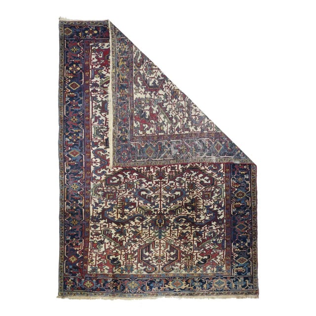 The warm ecru ground shows a central axial pole, anchored by two petal palmettes, with pairs and singletons of large,...