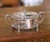 Crafted in France circa 1890, this elegant antique covered sugar bowl features a removable cut-crystal insert held within...